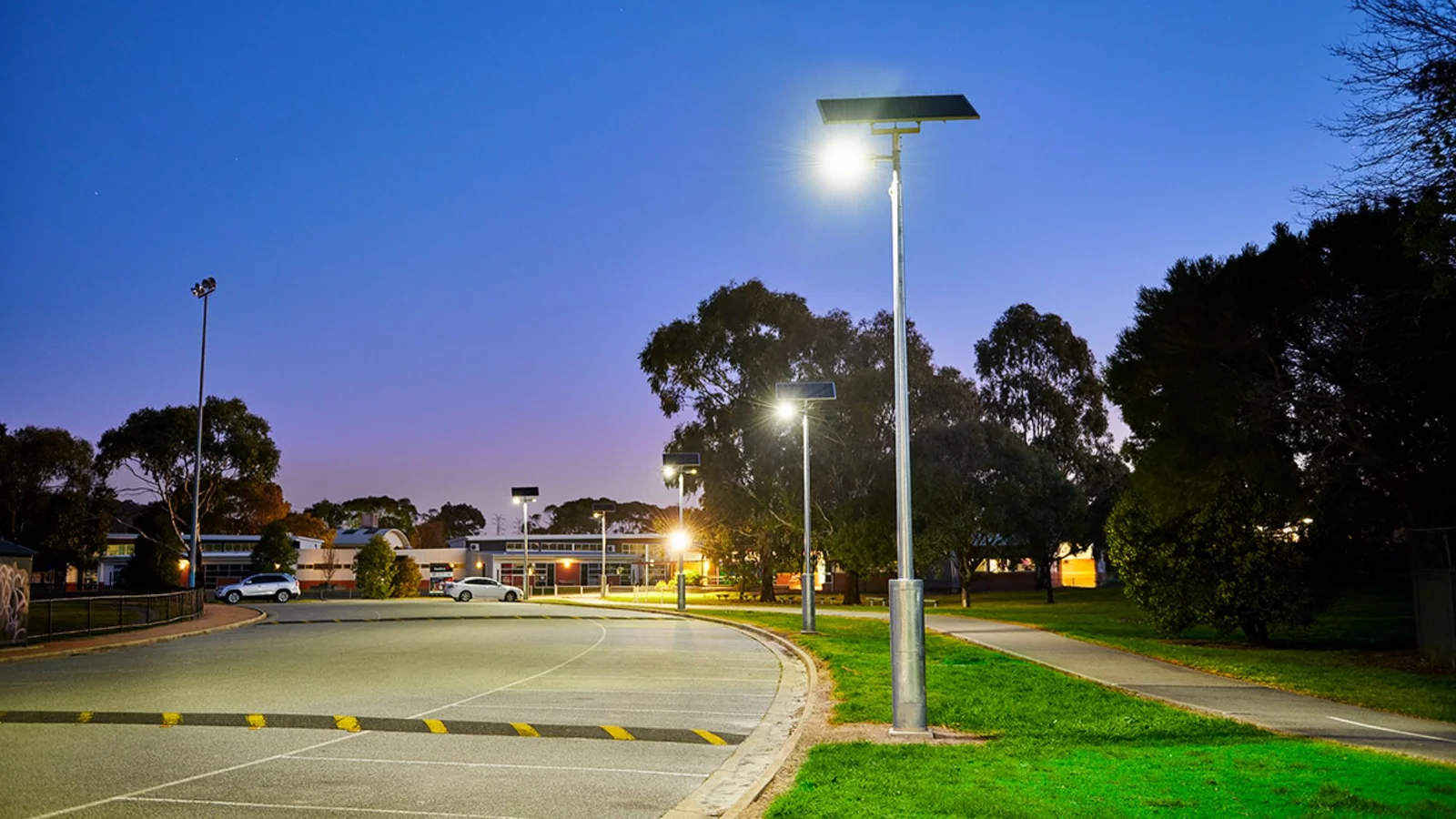 How do solar street lights drape the night in a green veil?