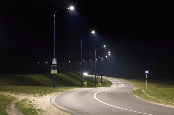 How do solar street lights rely on natural energy to reduce dependence on non-renewable energy?